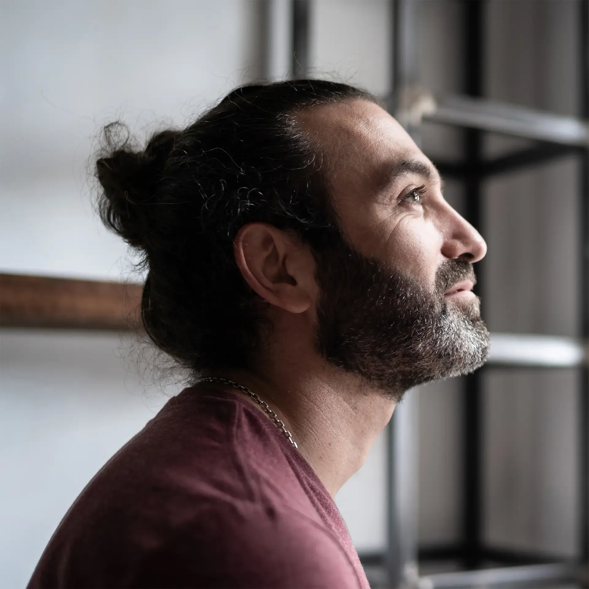 Man looking through the window at home